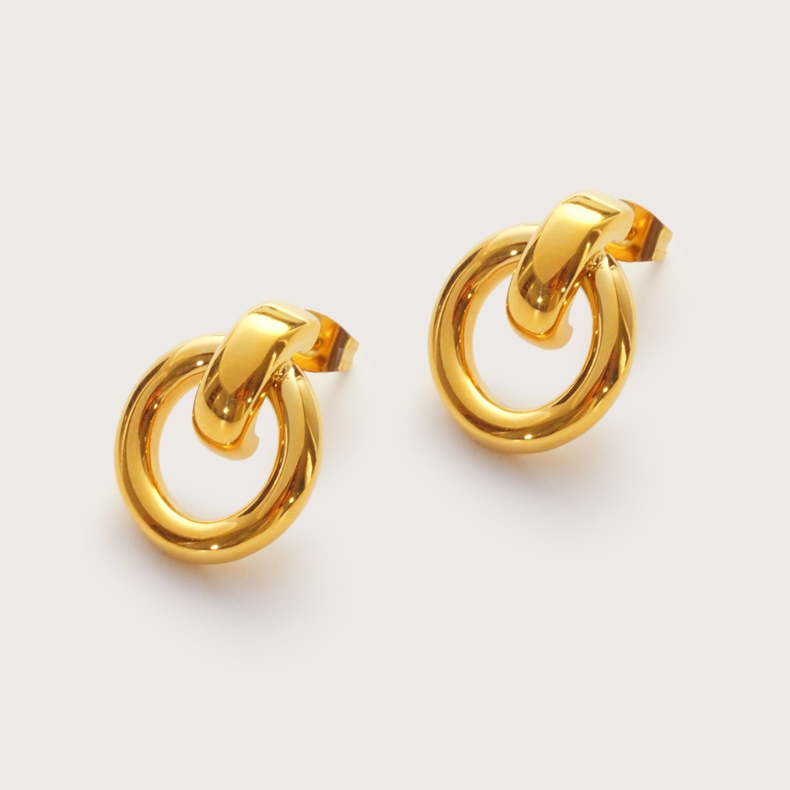 Gold Infinity Statement Studs detail showing smooth curved silhouette
