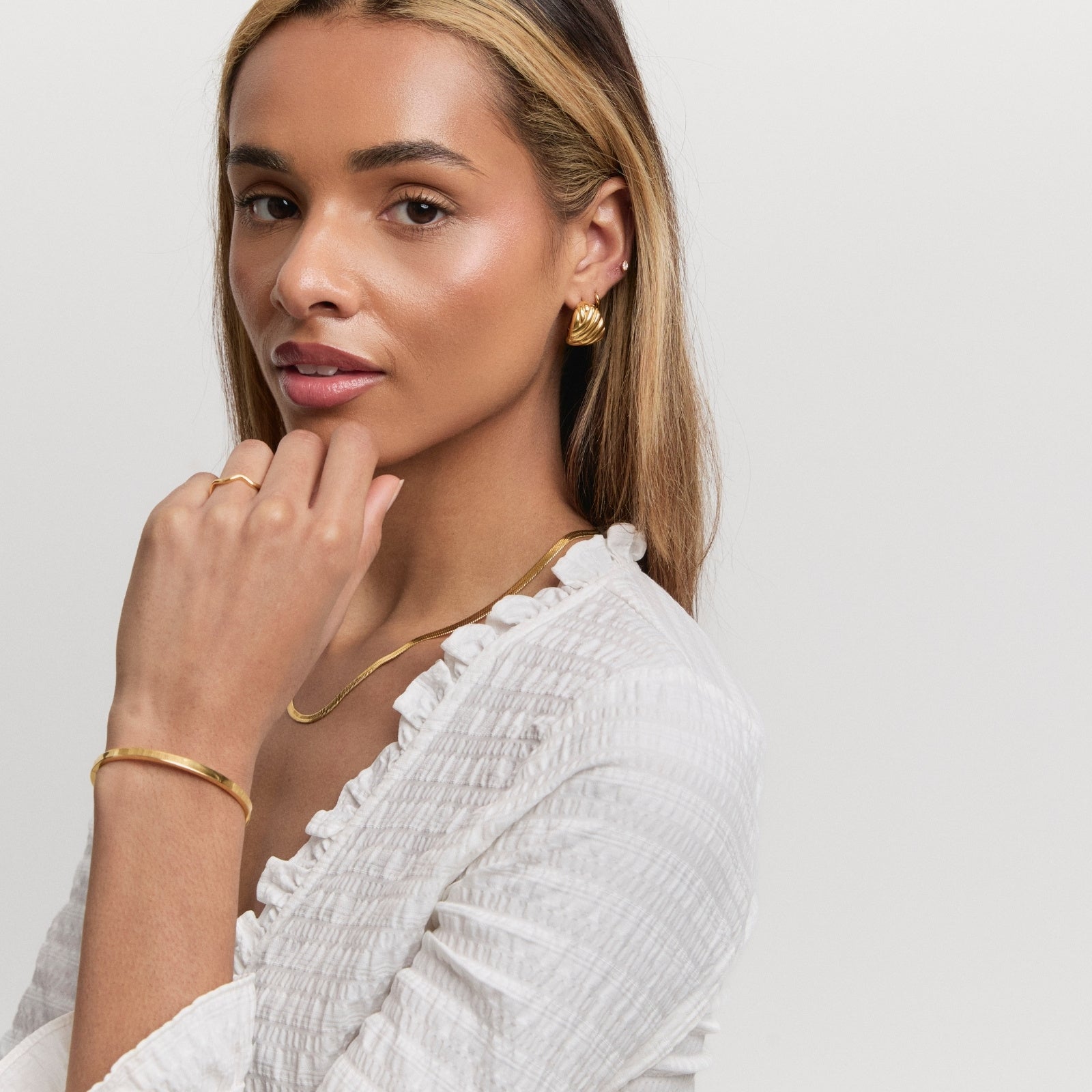 Gold Solstice Statement Studs – styling view