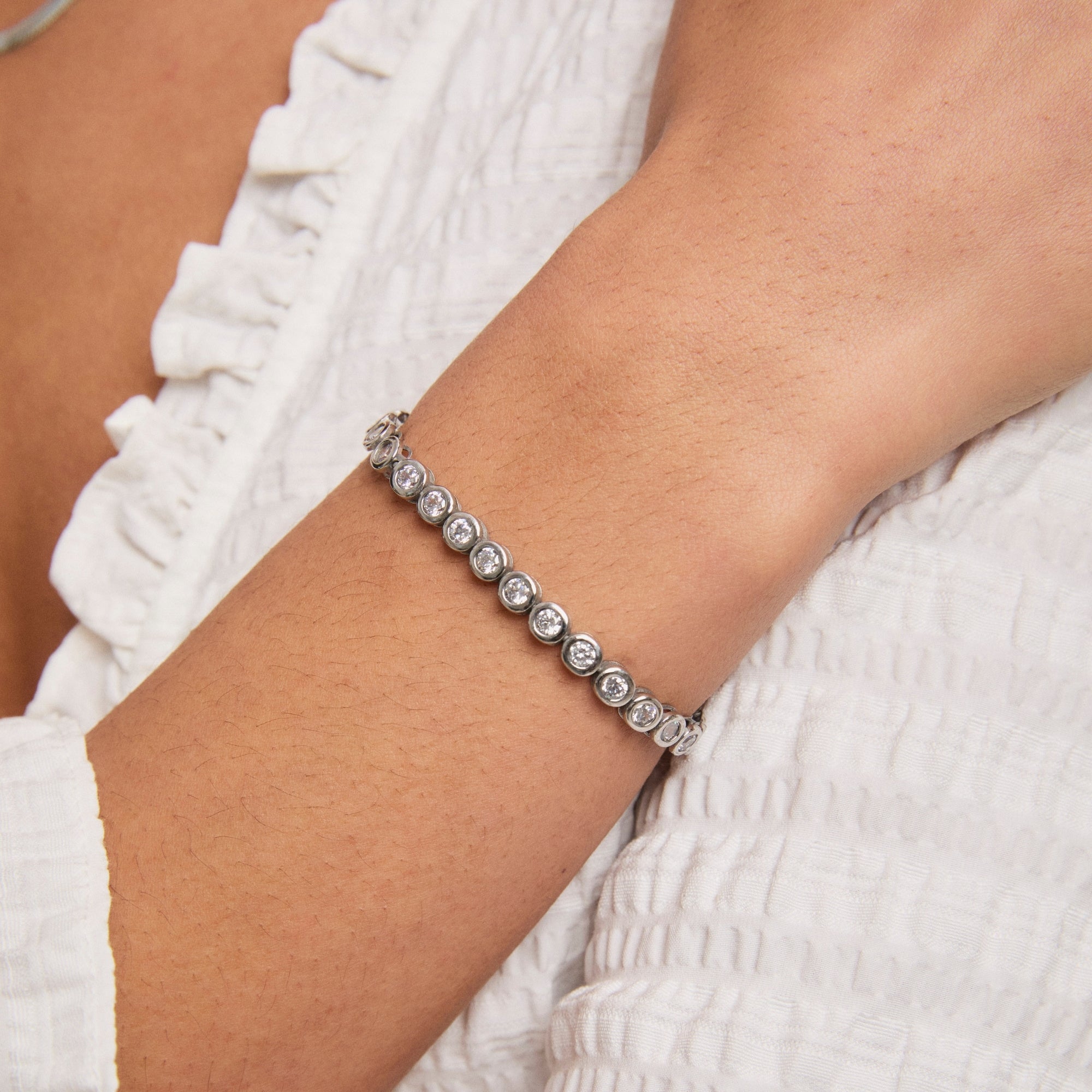 Silver Round Bezel Tennis Bracelet on model