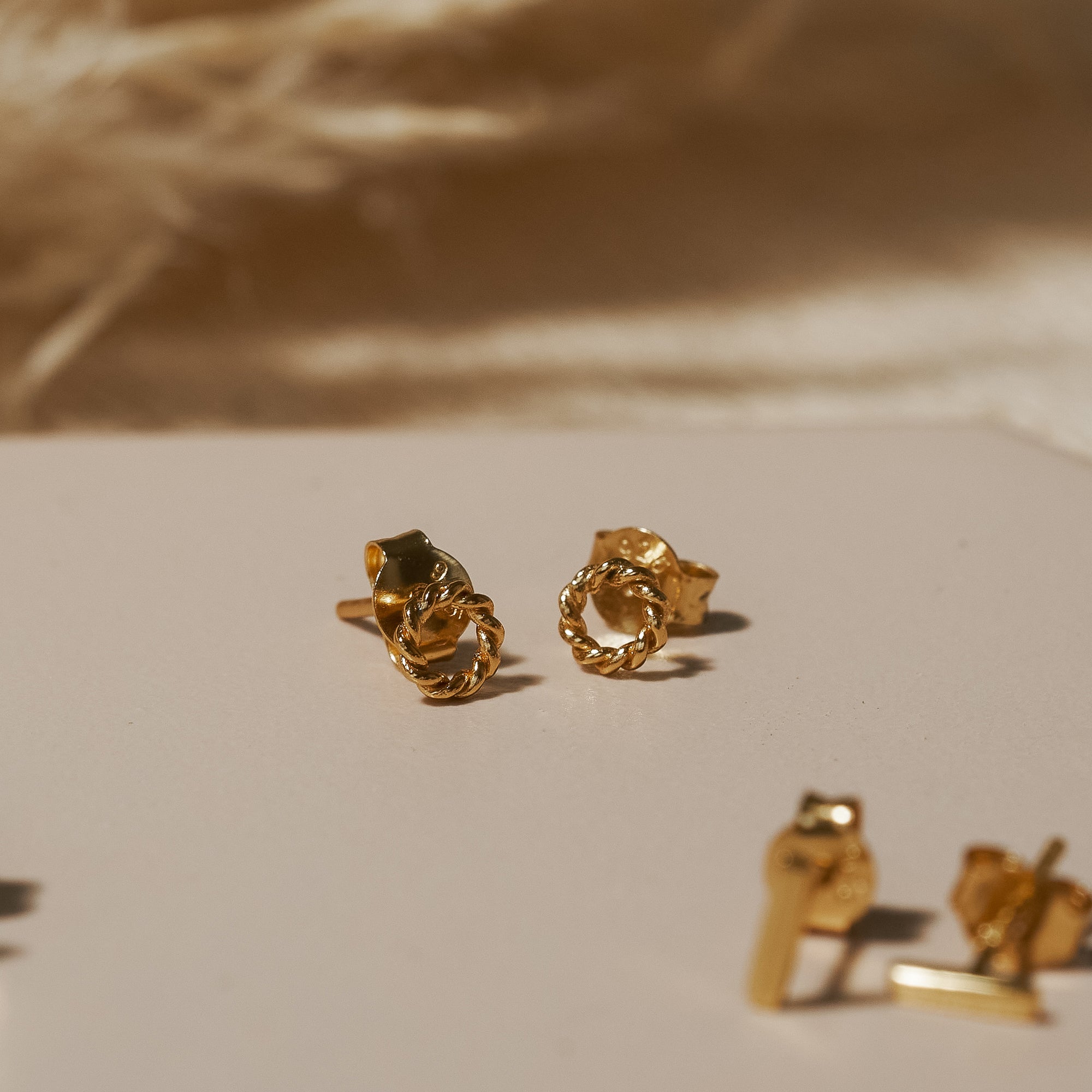 Gold Enlaced Circle Stud Earrings
