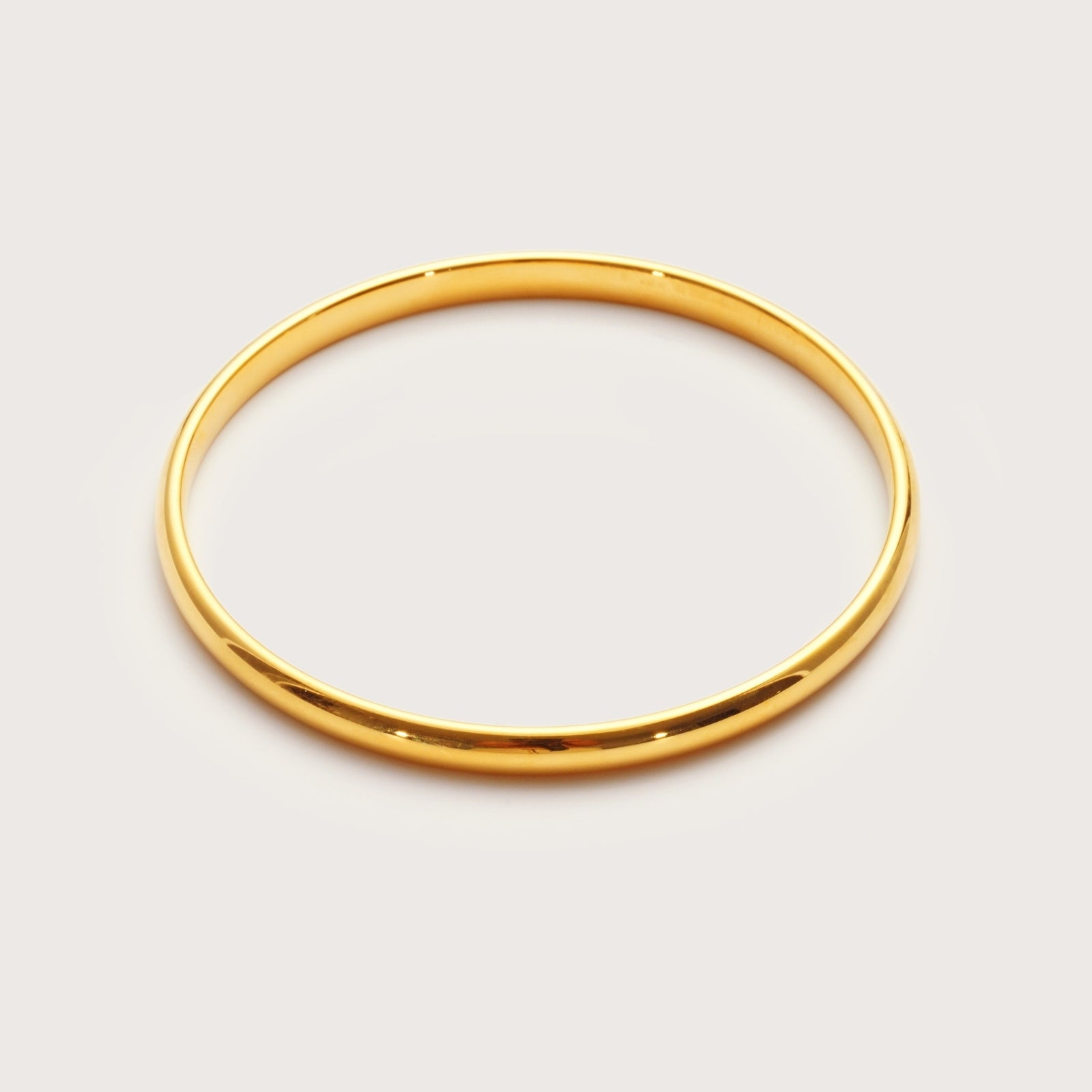 Gold Maxi Bangle on wrist