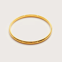 Gold Maxi Bangle on wrist