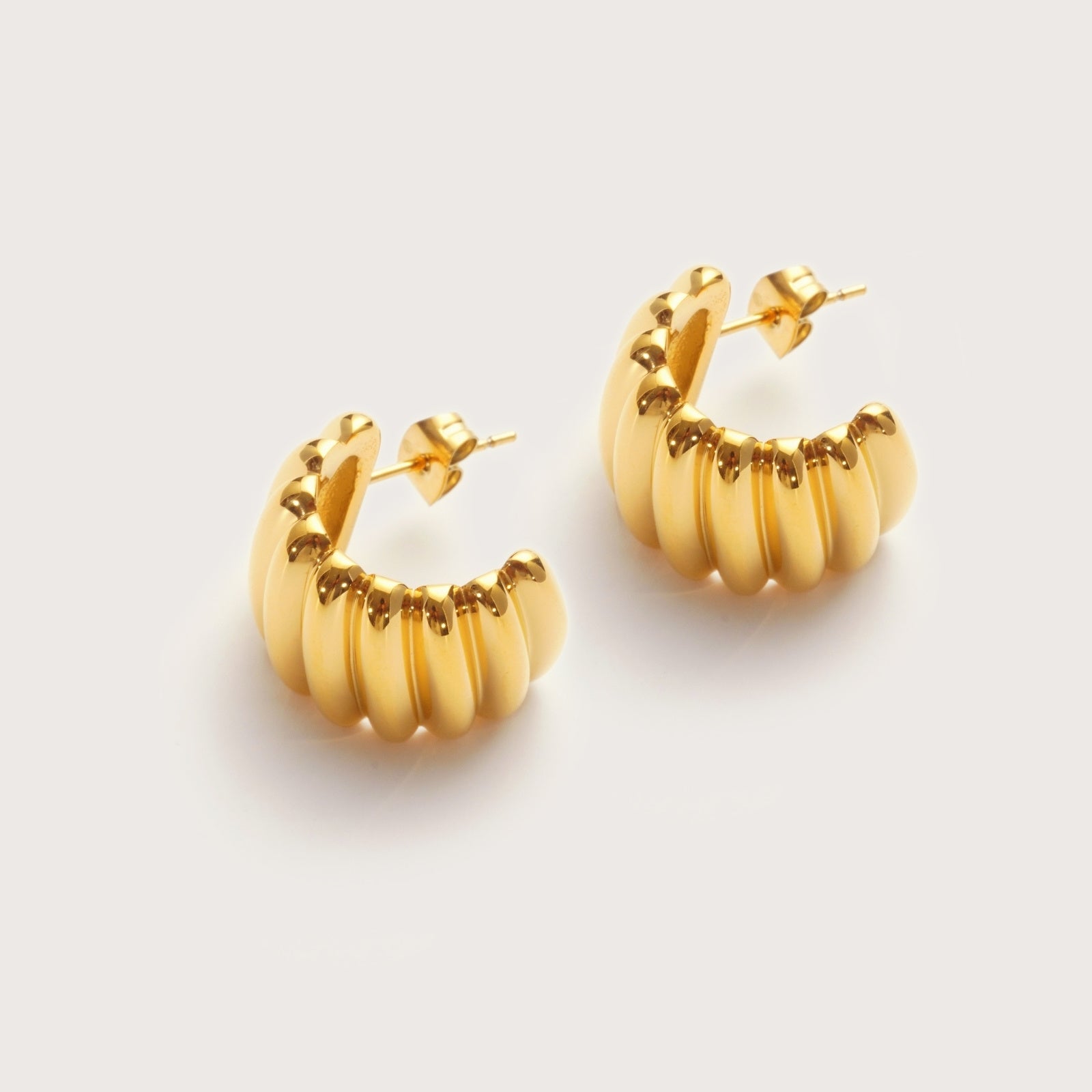 Gold Cove Statement Studs detail showing horizontal ridged texture