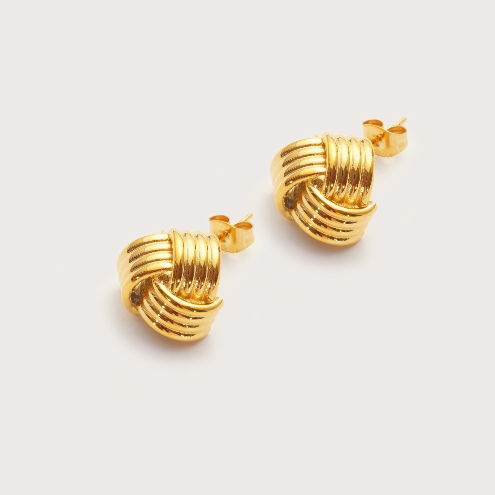 Gold Signature Knot Studs detail showing polished knot design