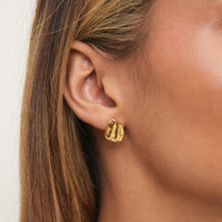 Gold Balearic Statement Studs on ear