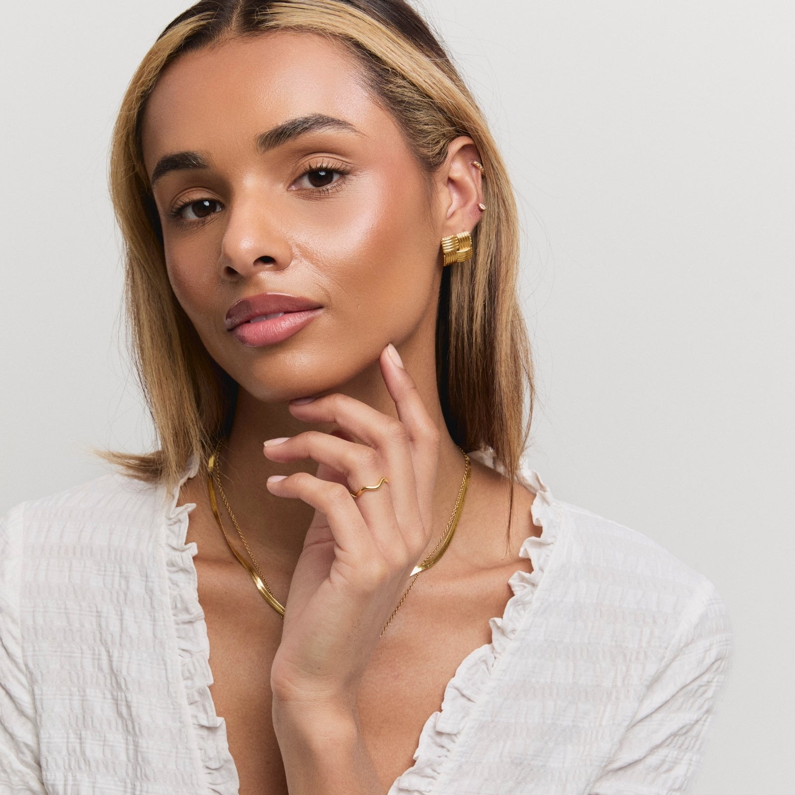 Gold Square Woven Statement Studs – styling view