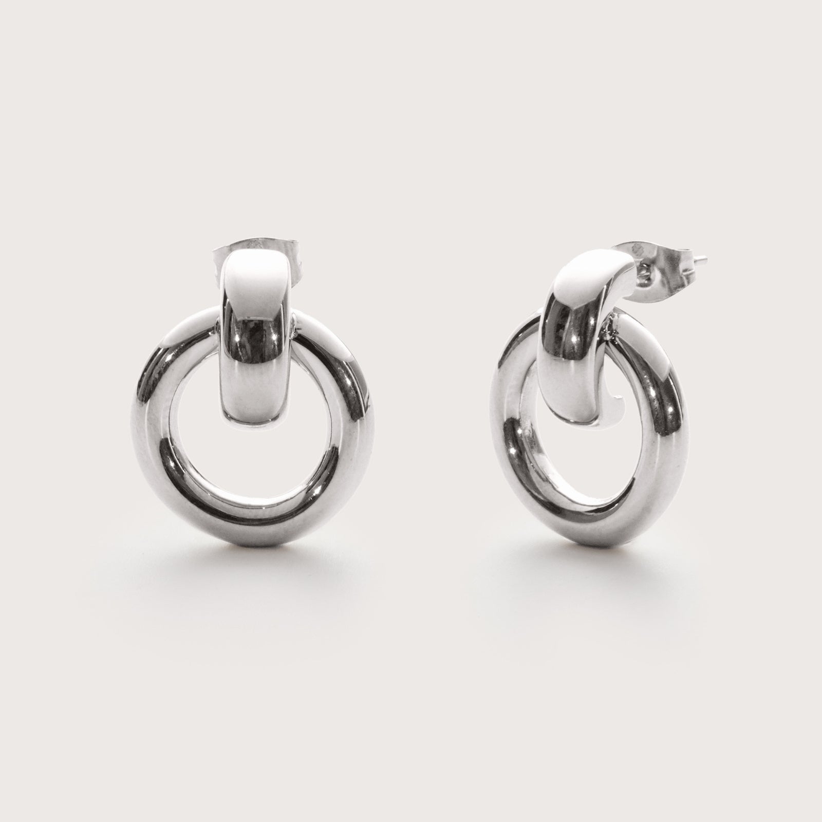 Silver Infinity Statement Studs – bold waterproof silver statement earrings