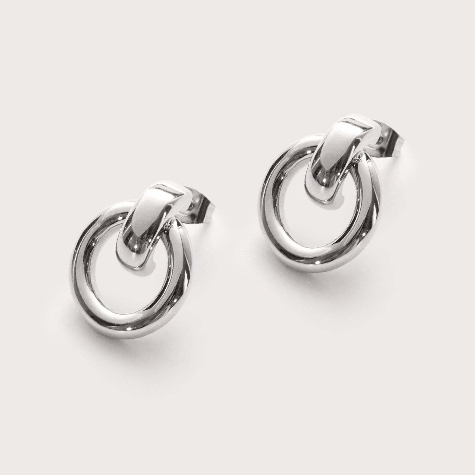 Silver Infinity Statement Studs detail showing smooth curved silhouette