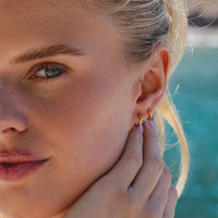 Gold Ultimate Huggies 8mm worn in summer outdoor lifestyle setting