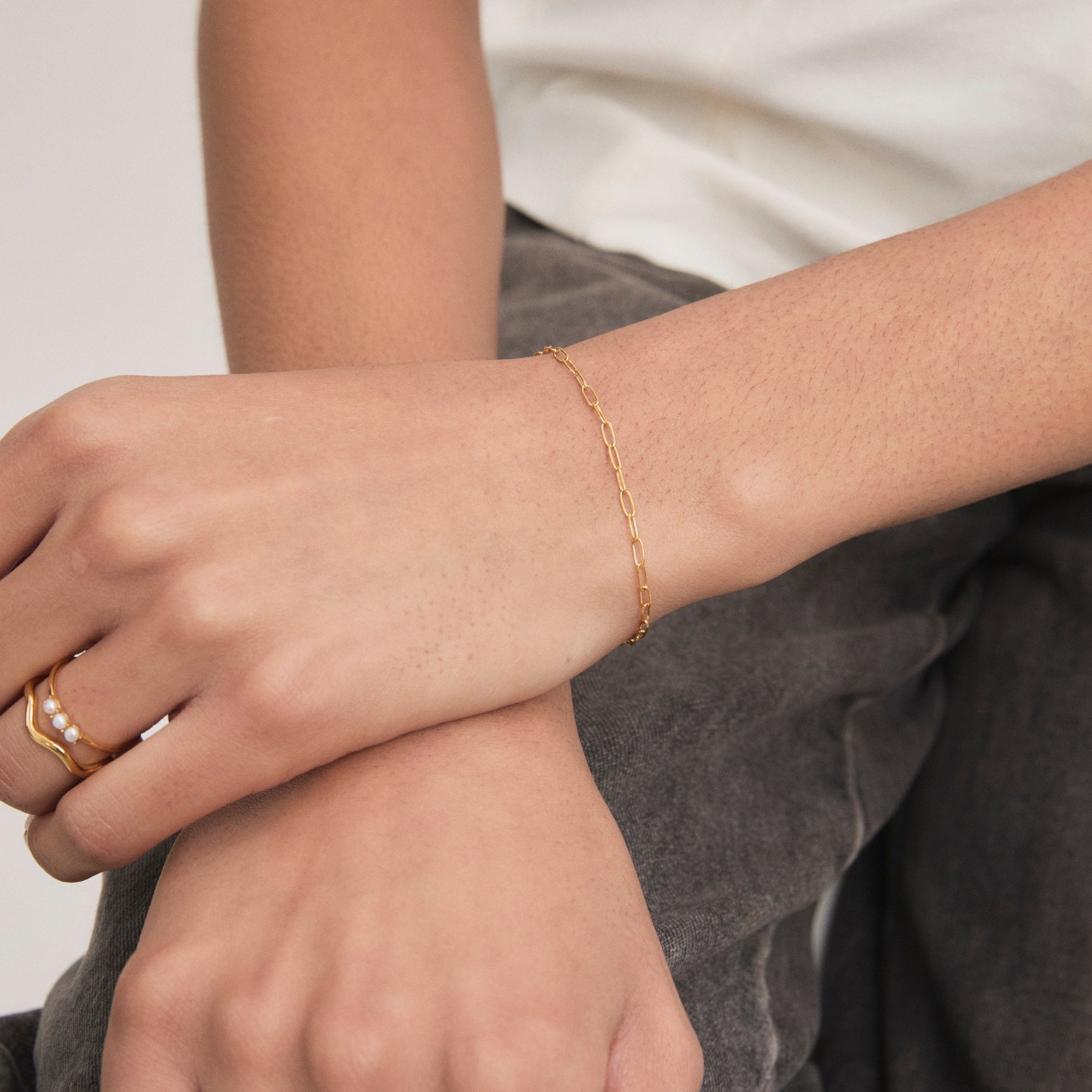 Gold Mini Paperclip Bracelet on model