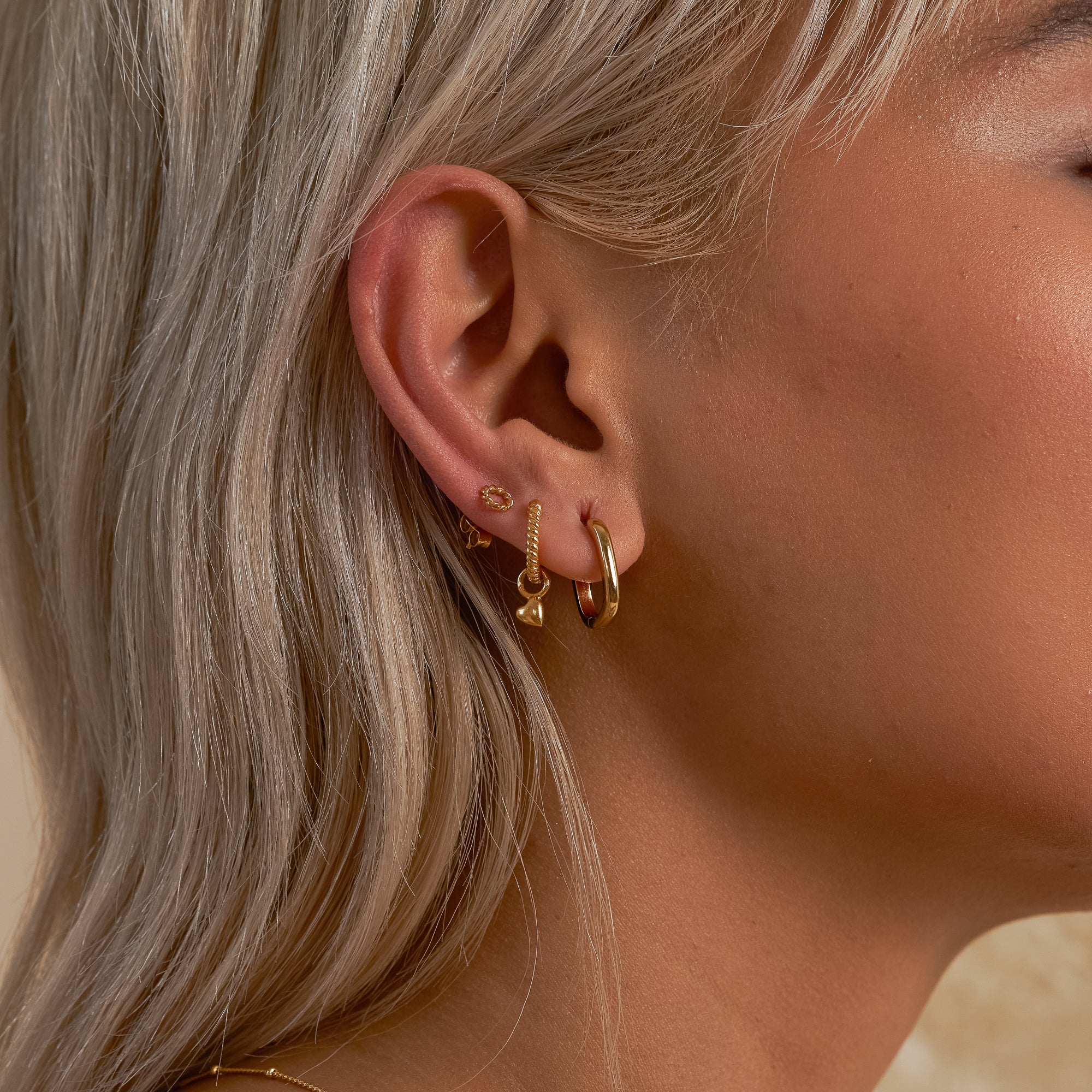 Gold Enlaced Circle Stud Earrings